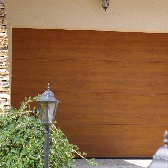 Porte de garage sectionnelle<br /> - modèle G woodgrain chêne doré